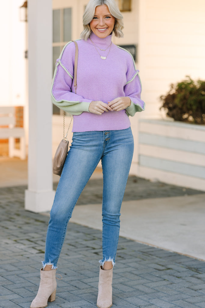 purple sweater with blue jeans outfit