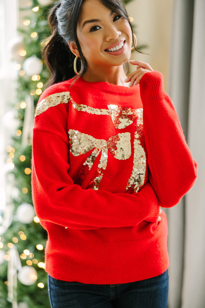 White jumper with shop red sequin bow