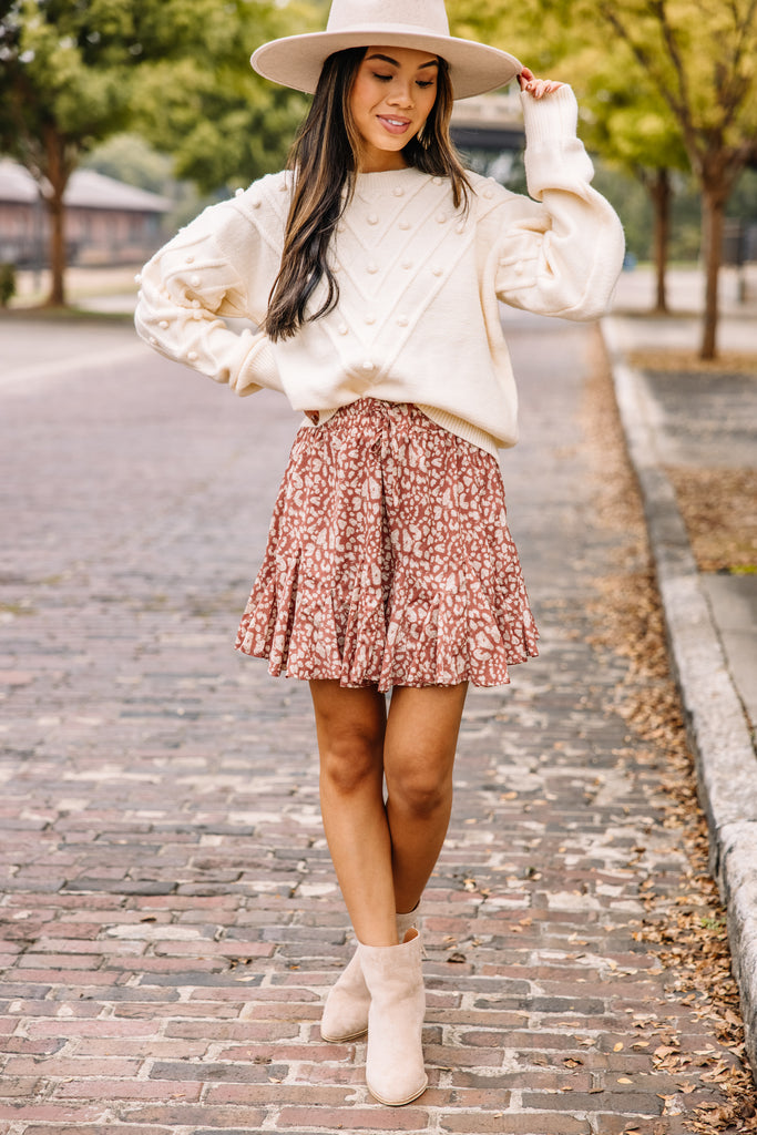 White sweater shop and floral skirt