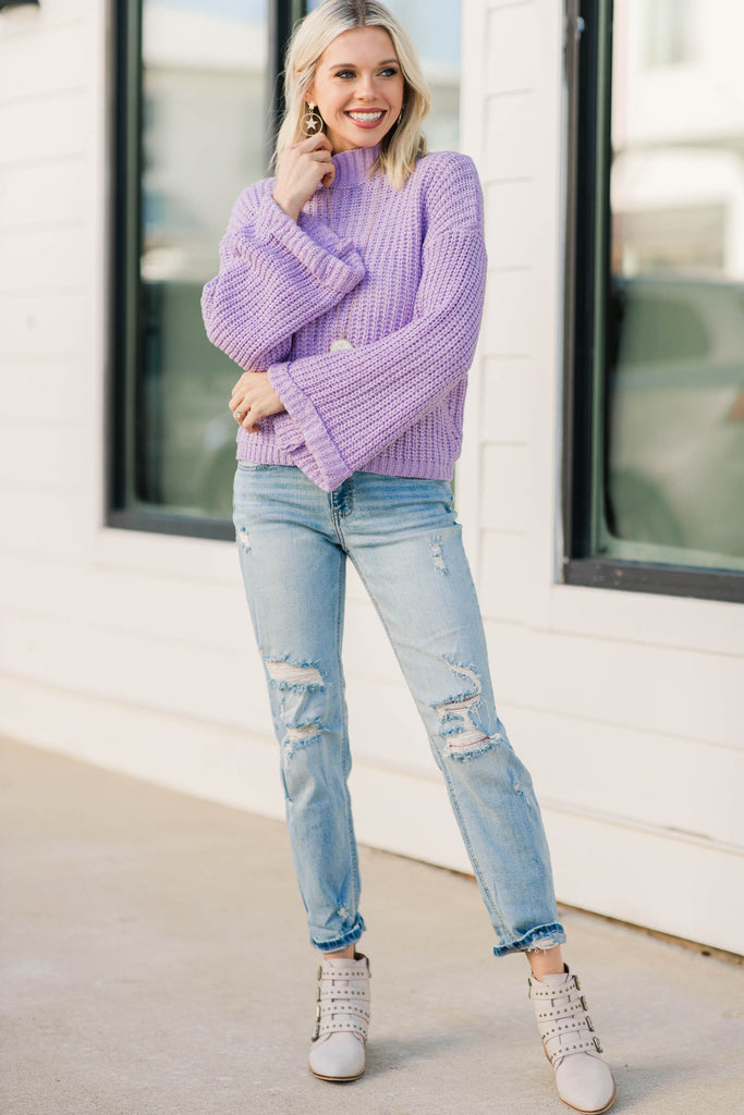 purple sweater with blue jeans outfit