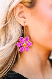 Pink floral earrings Gold hardware Chic accessory Perfect for day or evening wear Adds a pop of color to any outfit.