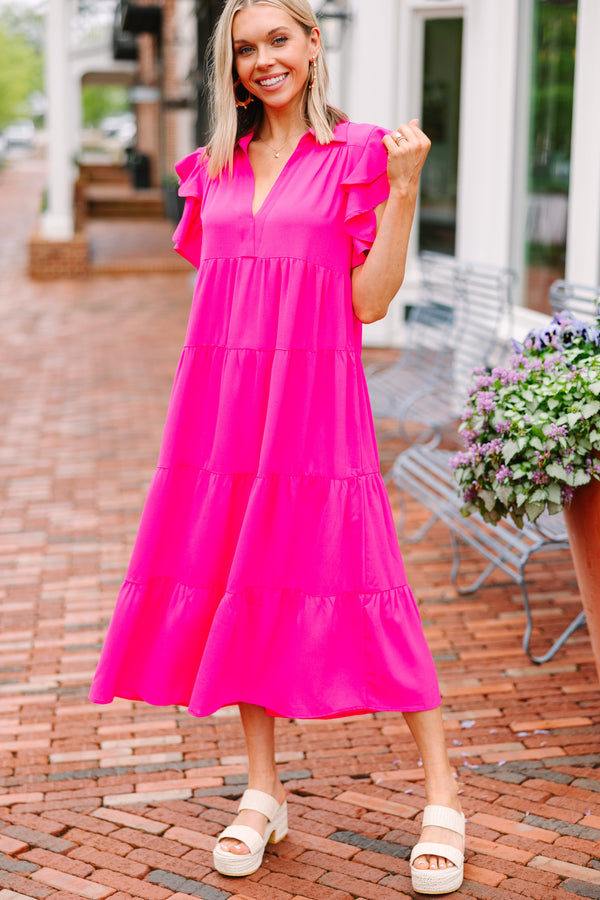 Pink tiered midi dress Ruffled sleeves Collared neckline Versatile fashion piece Ideal for formal and casual occasions.