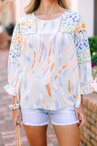Mixed print blouse Workday style Unique blend of prints Stylish statement