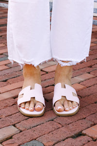 Pale pink slide-on sandals Easy-to-wear footwear Perfect for summer style Versatile color Comfort meets fashion.