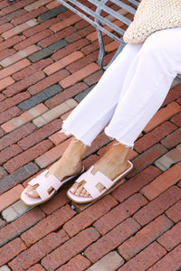 Pale pink slide-on sandals Easy-to-wear footwear Perfect for summer style Versatile color Comfort meets fashion.