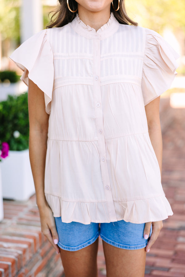 Conservative button-down blouse Fluttering short sleeves Tiered body Perfect for work or church Statement of elegance