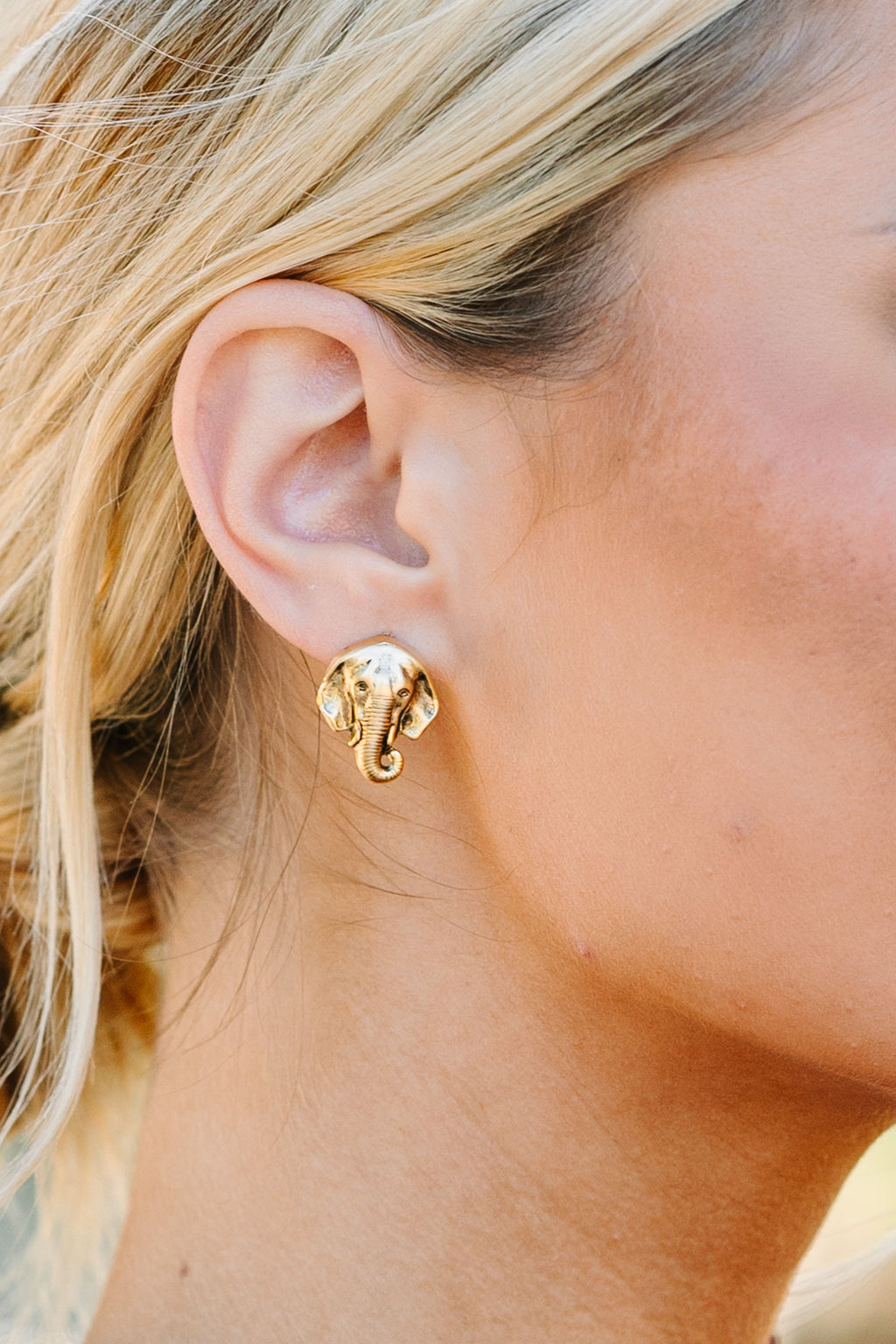 Elephant stud on sale earrings gold