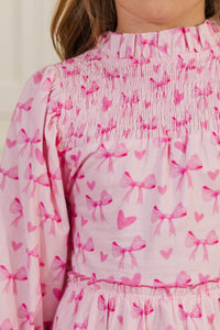 Girls: The Mariana Pink Bow Print Babydoll Dress