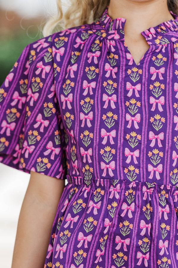 Girls: The Stephanie Plum Purple Bow Print Babydoll Dress