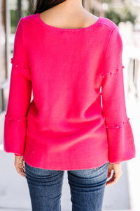 bright pink pompom sweater