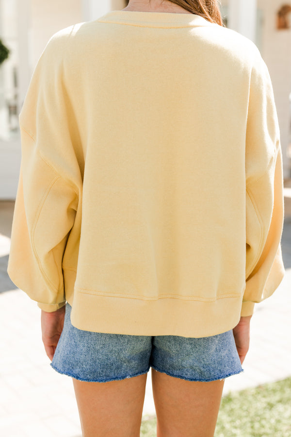 solid yellow pullover