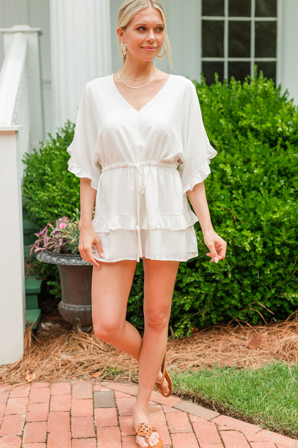 white ruffled romper