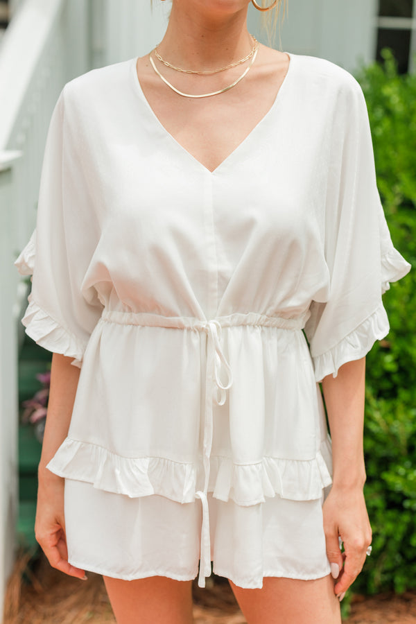 white ruffled romper