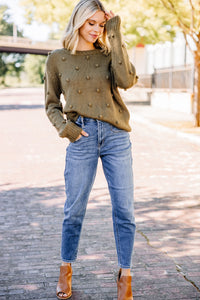 green pompom sweater