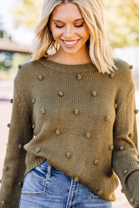 green pompom sweater