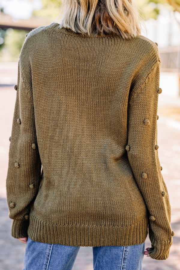 green pompom sweater