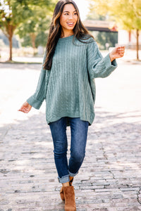 green cable knit sweater