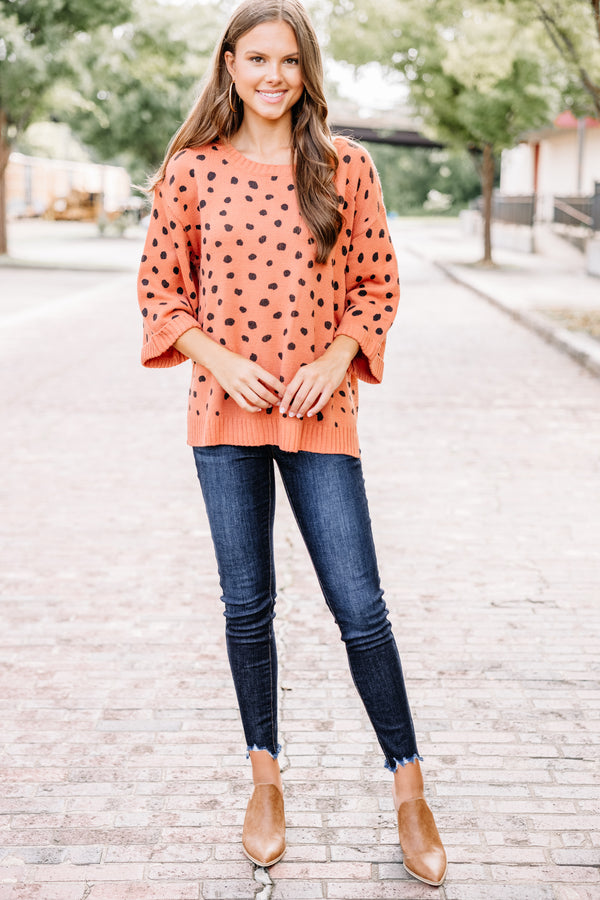 orange spotted sweater