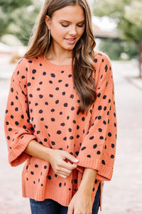 orange spotted sweater