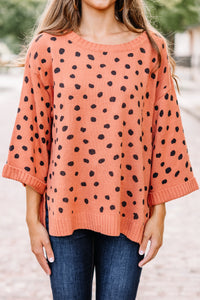 orange spotted sweater