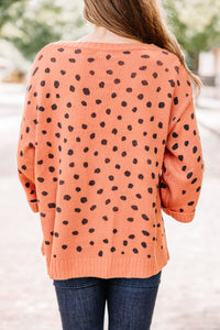 orange spotted sweater