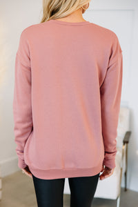 embroidered pink sweatshirt