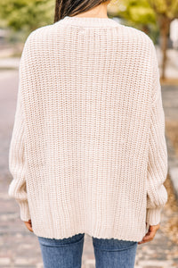 white pompom sweater