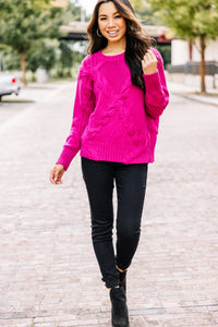 bright pink cable knit sweater