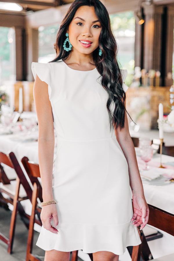 feminine white ruffled dress