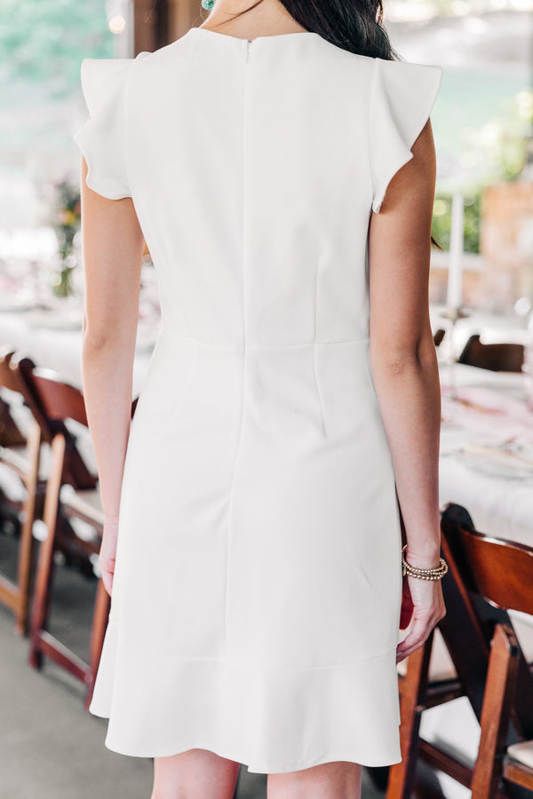 feminine white ruffled dress