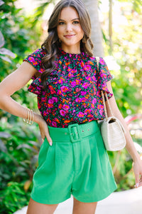 black floral blouse with short ruffled sleeves