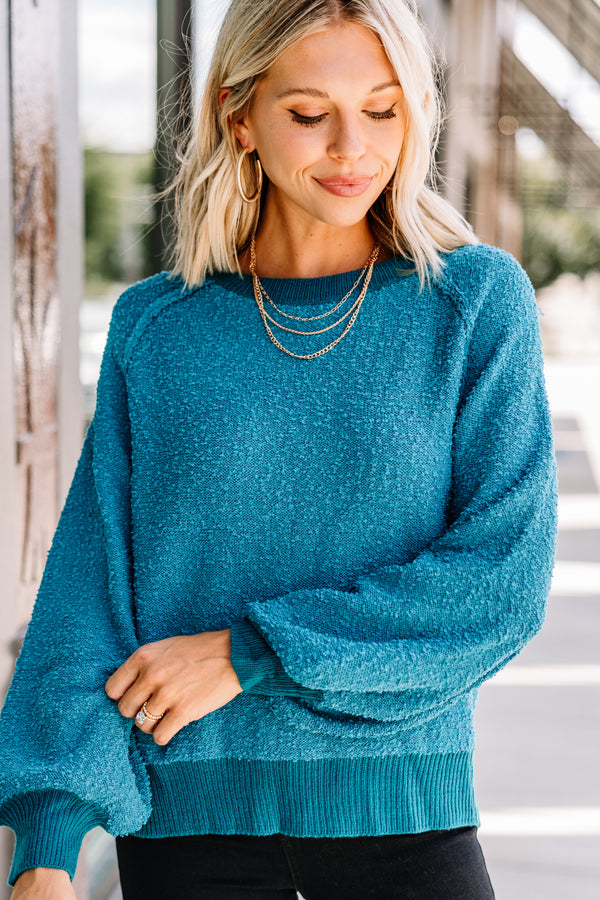 bright blue sweater