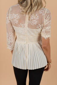 romantic top, delicate lace, peplum hem, feminine, sweet, top, lace detailing, 3/4 sleeve, pleated back, round neckline, zip up back