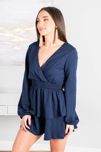 long, bubble sleeves, a v-neck surplice neckline, a smocked waist, tiered detailing