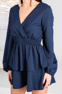 long, bubble sleeves, a v-neck surplice neckline, a smocked waist, tiered detailing