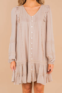 v-neck, button down front closure, crochet, ruffled details, long bubble sleeves, ruffled hem