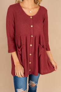 red tunic, tunic, round neckline, long sleeves, button detailing, waffle knit fabric, pockets, layering