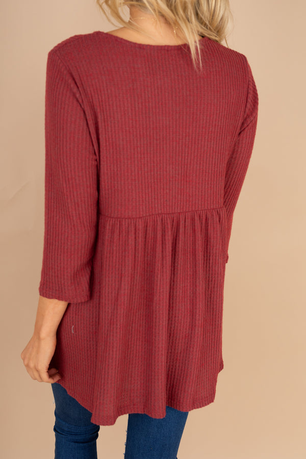 red tunic, tunic, round neckline, long sleeves, button detailing, waffle knit fabric, pockets, layering