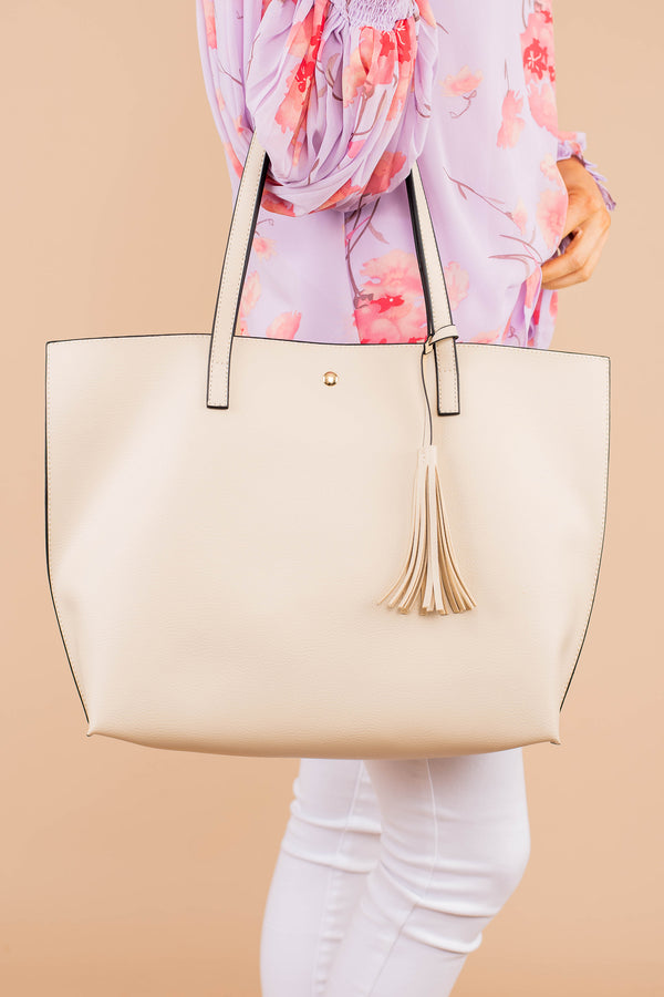 purse, bag, tassel detail, button closure, beige, handbag