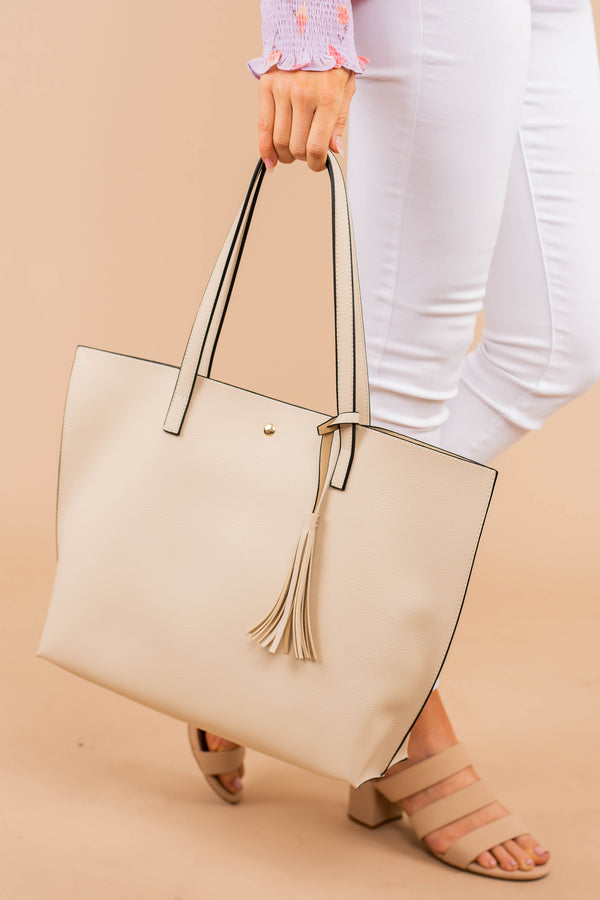 purse, bag, tassel detail, button closure, beige, handbag