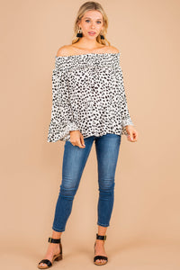 top, white, smocked off the shoulder neckline, spotted leopard print, long bell sleeves, chic