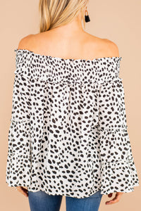 top, white, smocked off the shoulder neckline, spotted leopard print, long bell sleeves, chic