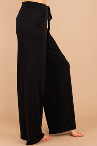 soft stretch fabric, pants, black pants, tied front waist, pockets, wide leg hem, palazzo pants