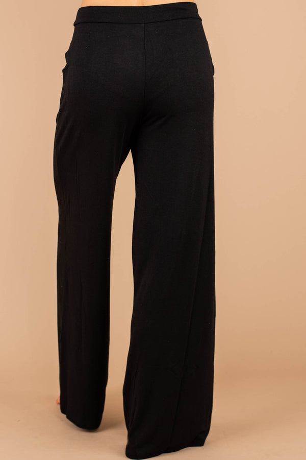 soft stretch fabric, pants, black pants, tied front waist, pockets, wide leg hem, palazzo pants