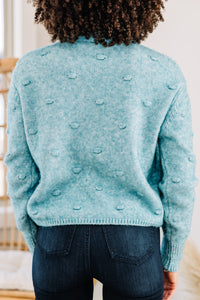 pompom blue sweater