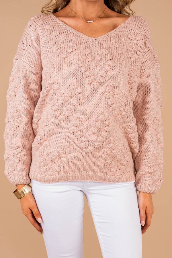 sweater, pink sweater, v-neckline, long sleeves, knit fabric, pompoms