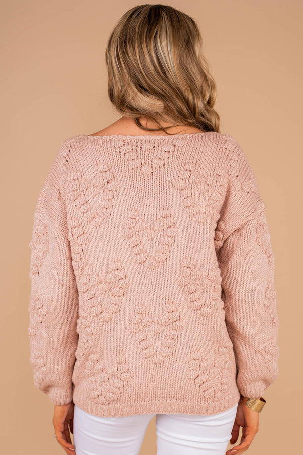 sweater, pink sweater, v-neckline, long sleeves, knit fabric, pompoms